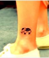 tatuaże słonie na kostce