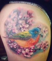 ptak i kwiatki tatuaże