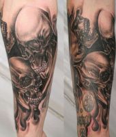 dwie ludzkie czaszki tatuaże