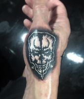 demon twarz tatuaż
