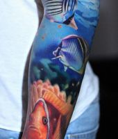 kolorowe ryby tatuaże na ręce