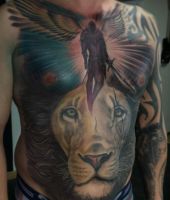 duża głowa lwa na brzuchu - tatuaże