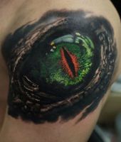 zielone oko gada | tatuaż