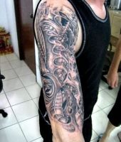 biomechanical tattoo on arm