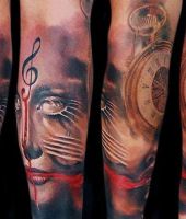 klucz wiolinowy i zegar tatuaże