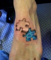 puzzle tatuaże na stopie